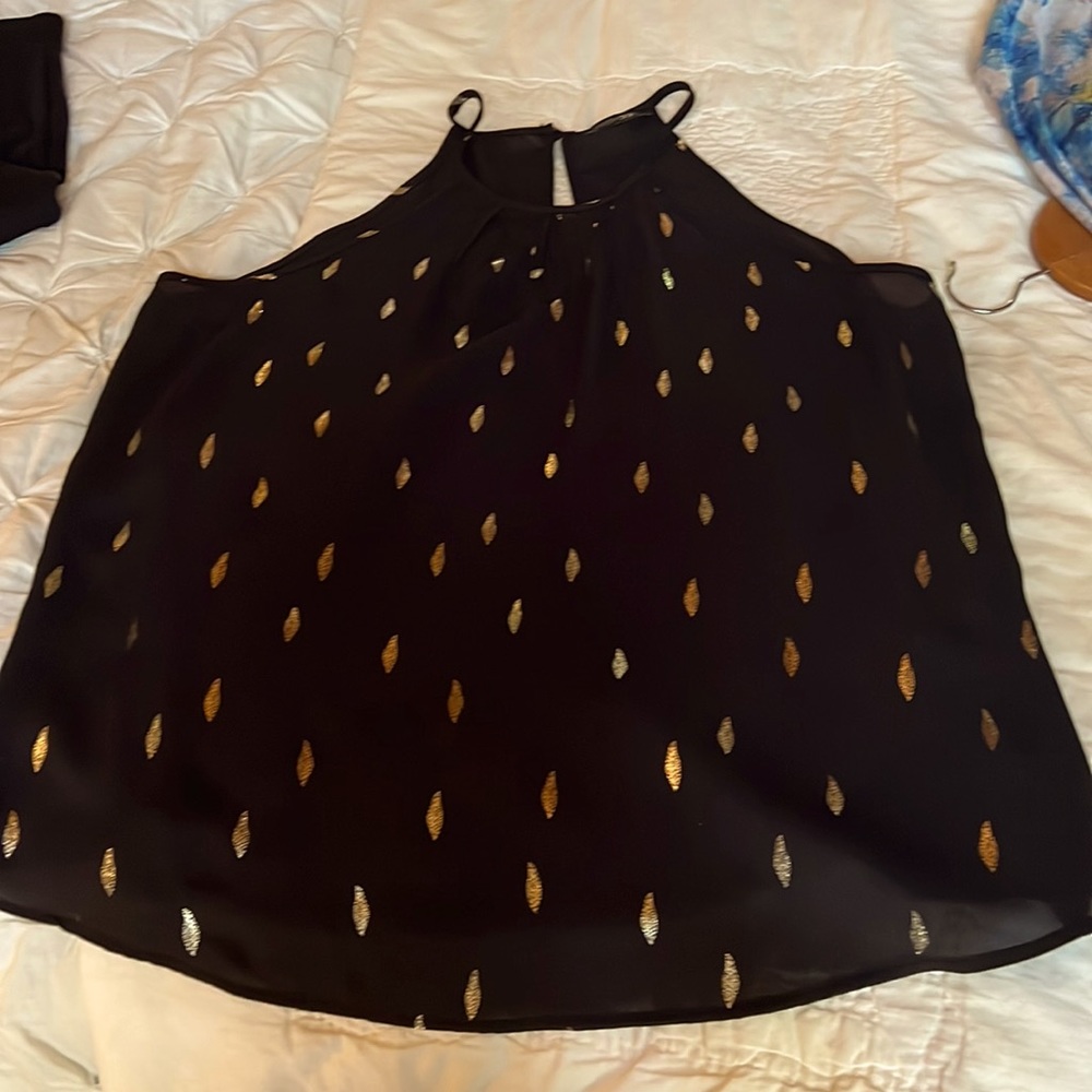 Black tank top style with silver leaves, never worn but no tags